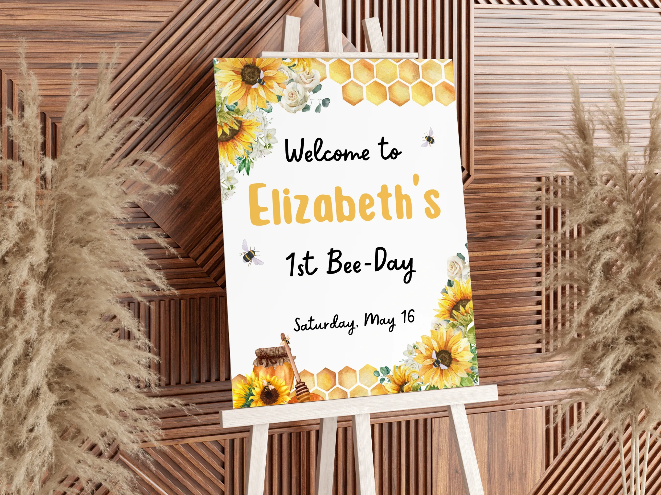 First Bee Day birthday welcome sign with sunflower and bumble bee design, yellow floral theme, editable Canva template by fllcdesigns