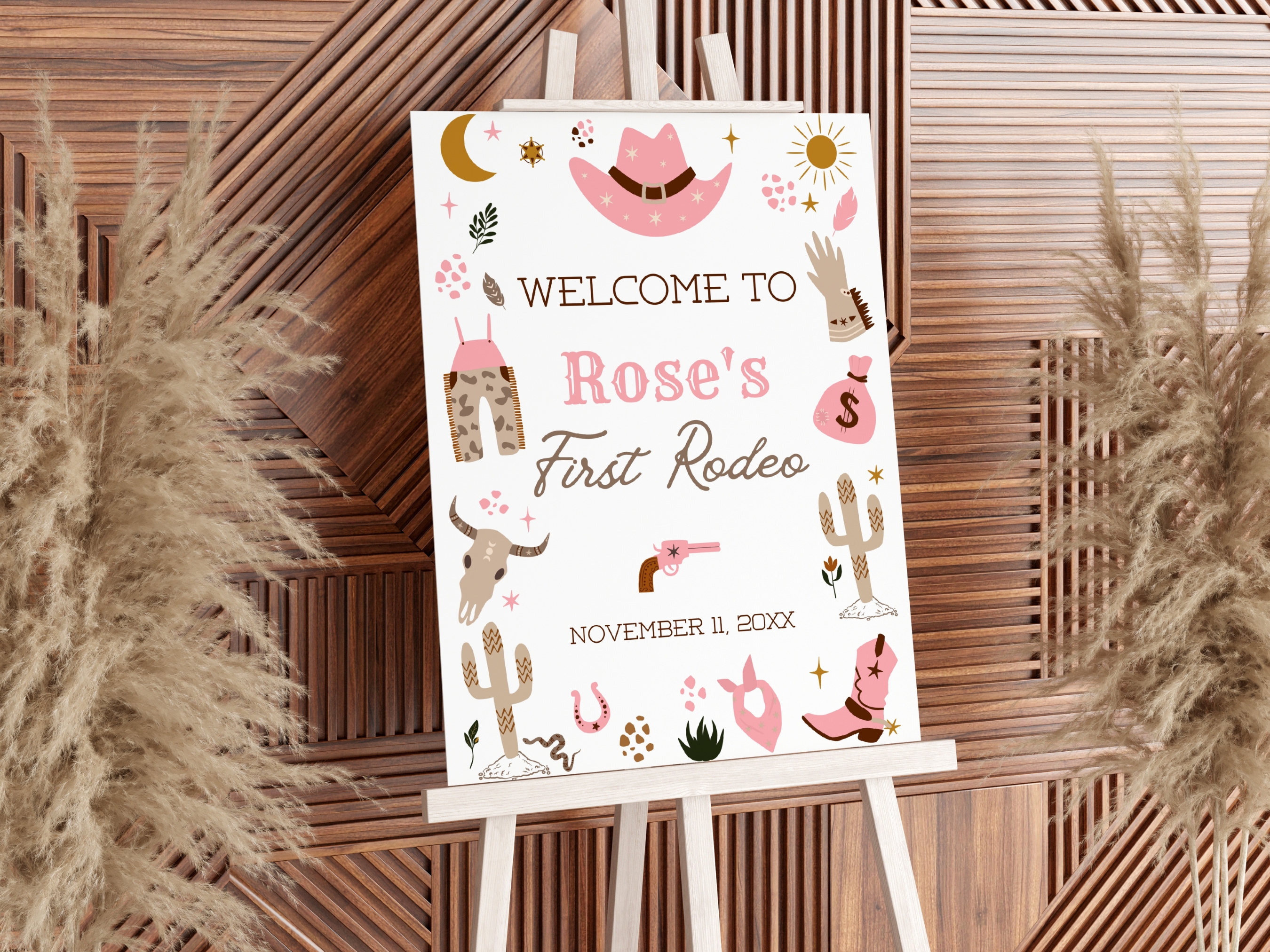 Cowgirl My First Rodeo birthday welcome sign with pink western theme, cowboy hat, boots and stars, editable Canva template by fllcdesigns