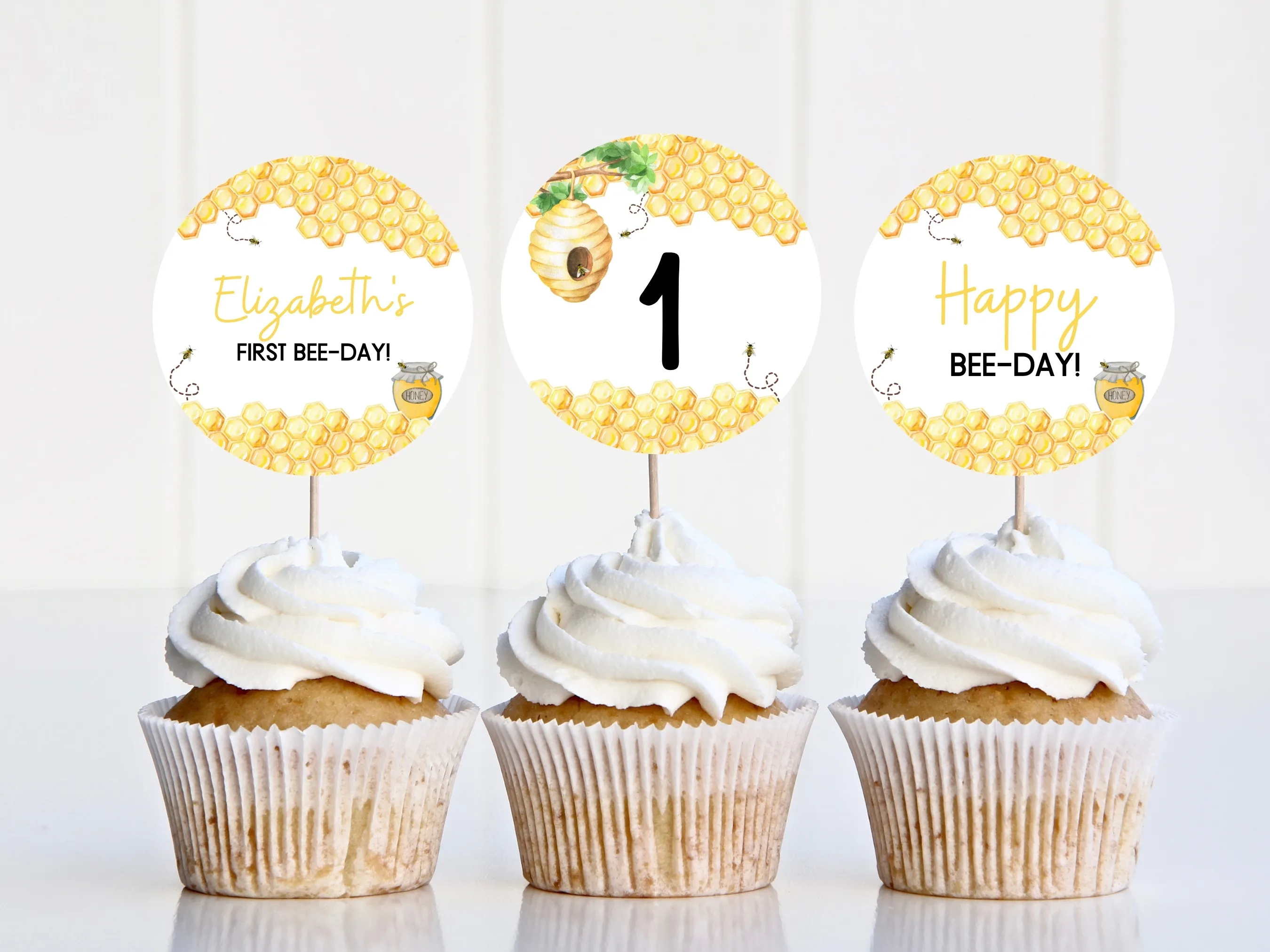 First Bee Day cupcake toppers with bumble bee and honey bee designs, matching “One” cake topper for 1st birthdays, editable Canva template by fllcdesigns