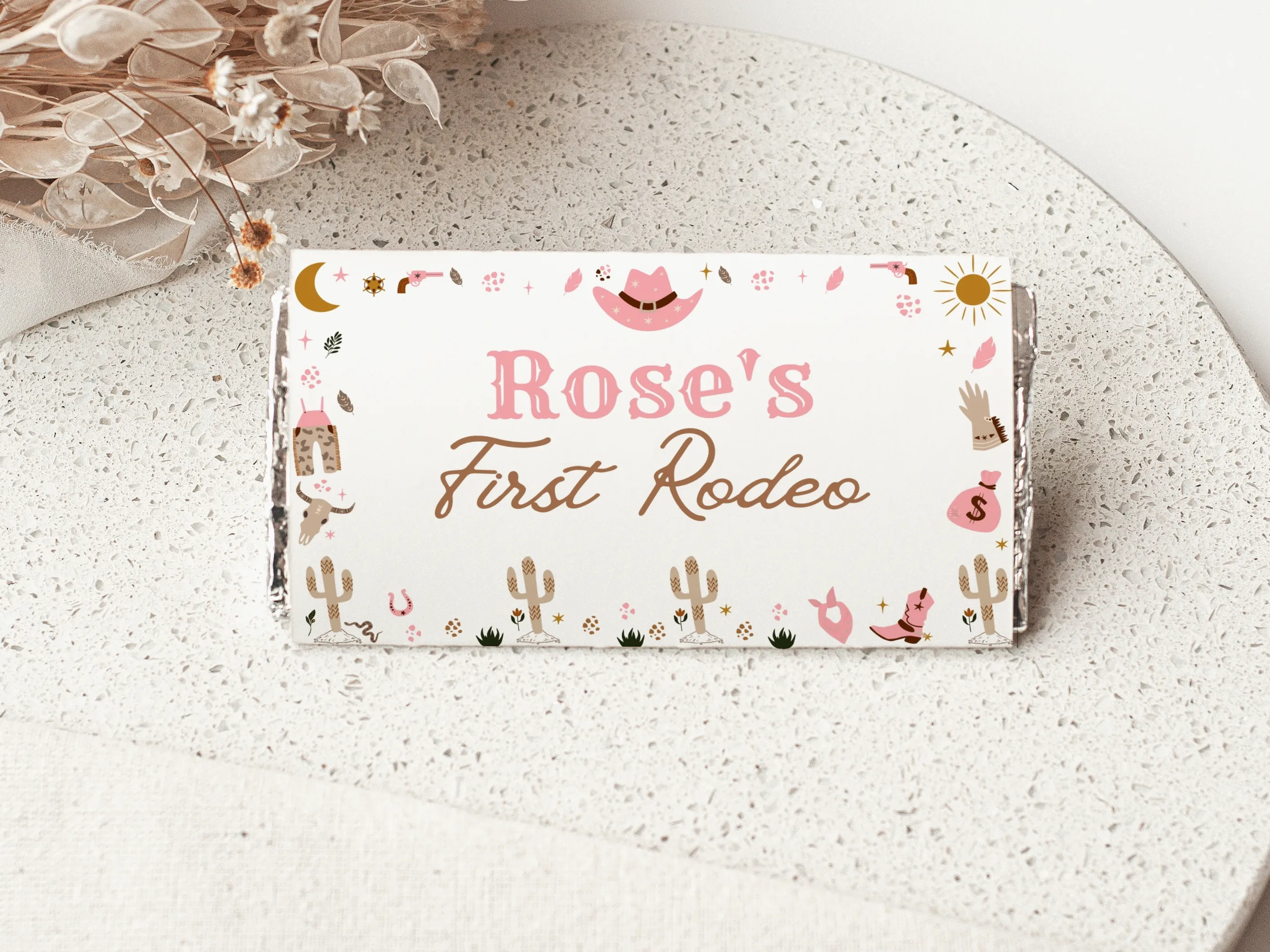 My First Rodeo cowgirl chocolate wrappers with pink western theme, matching candy wrappers and candy bar labels, editable Canva template by fllcdesigns