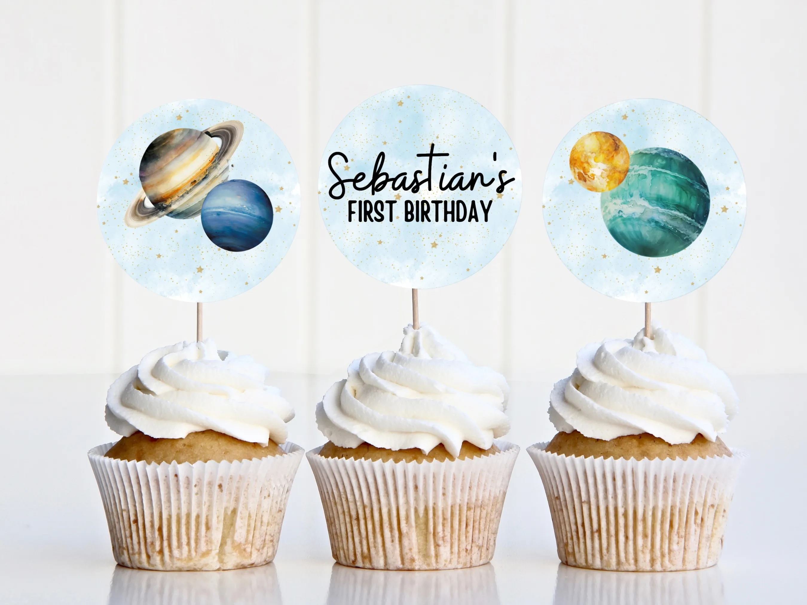 Outer space cupcake toppers with planets and stars, including matching planets “One” cake topper for First Trip Around the Sun birthdays, editable Canva template by fllcdesigns