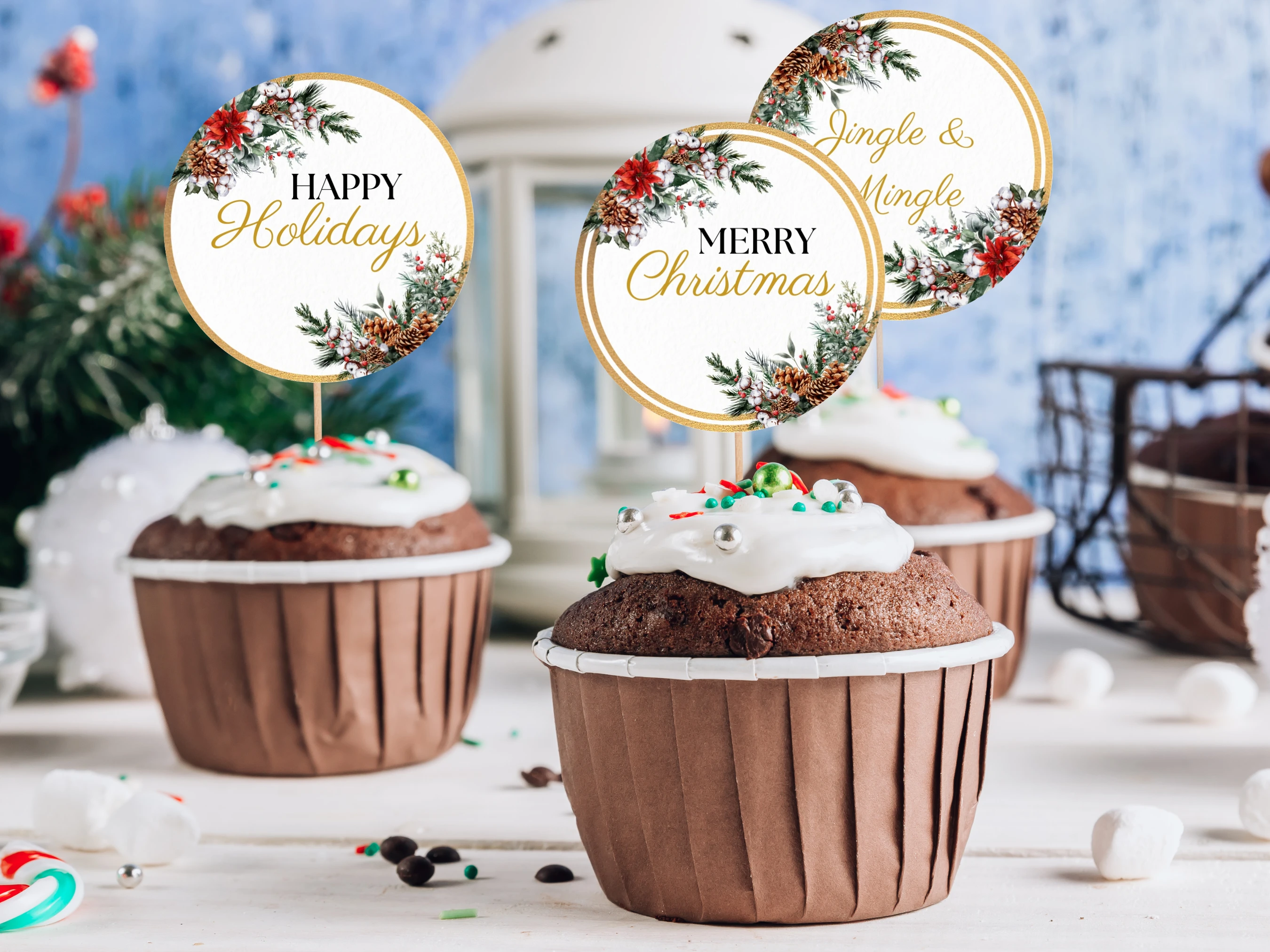 Round Christmas cupcake toppers with golden frames, festive greenery, red berries, pinecones and Merry Christmas, Happy Holidays and Jingle and Mingle