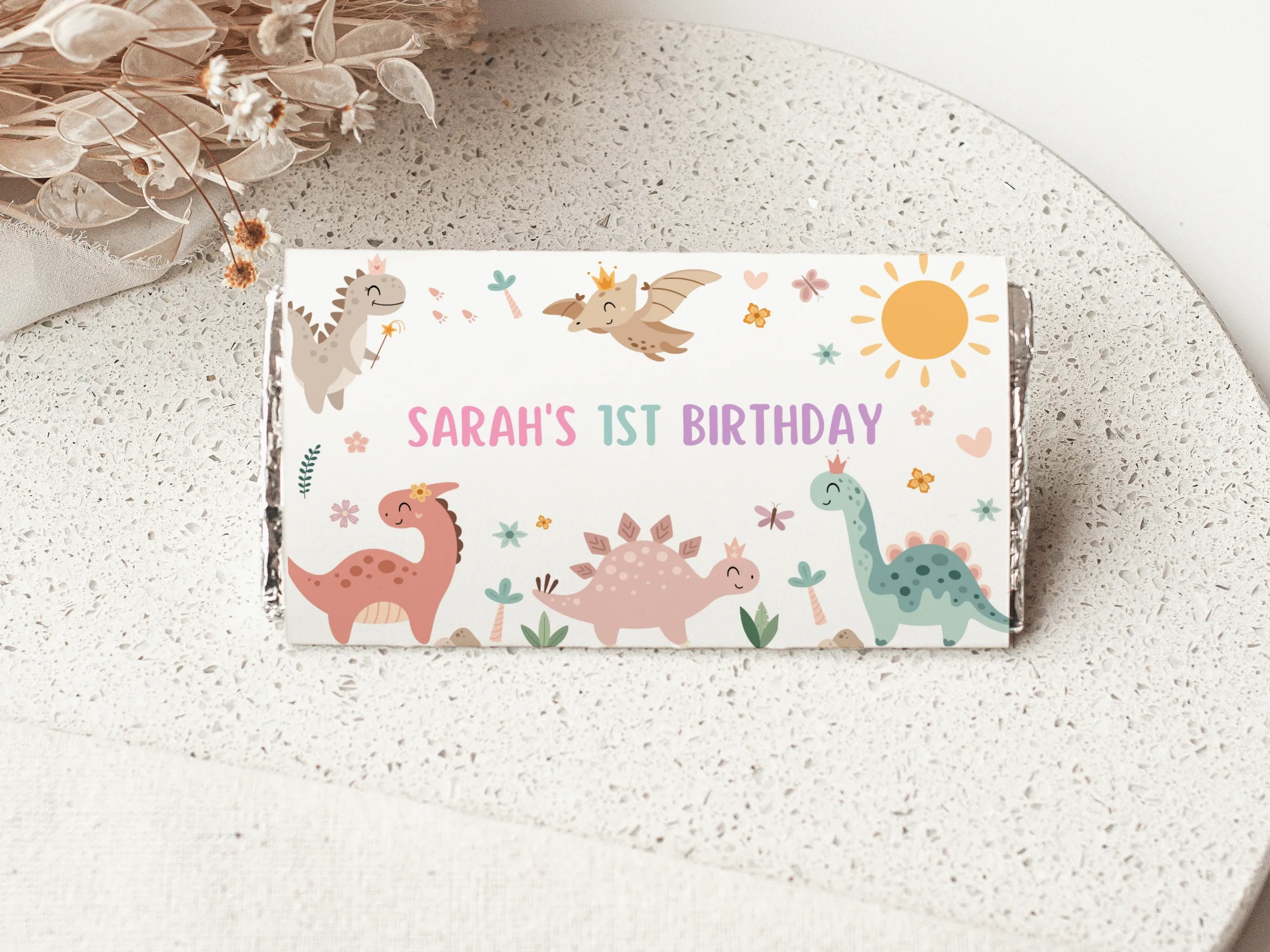 Baby girl dinosaur chocolate wrappers with cute pink dino design, birthday candy bar labels, editable Canva template by fllcdesigns